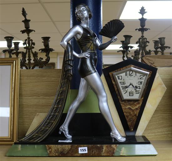 A French Art Deco bronzed spelter and marble mantel clock, the dial signed Divay height 58cm